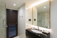 a bathroom with a sink and a mirror at Krabi Heritage Hotel in Ao Nang Beach