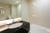 a bathroom with a sink and a mirror at Krabi Heritage Hotel in Ao Nang Beach