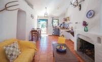 a living room with a couch and a fireplace at Finca El Huertezuelo in El Bosque