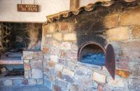 a brick oven with a pizza in it at Finca El Huertezuelo in El Bosque