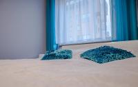 Łóżko lub łóżka w pokoju w obiekcie Dream Bay Apartment