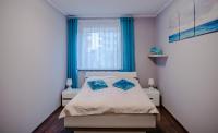 Łóżko lub łóżka w pokoju w obiekcie Dream Bay Apartment