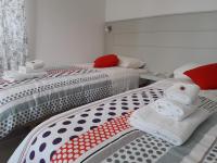 A bed or beds in a room at Jolie Julie Accomodation