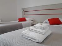 A bed or beds in a room at Jolie Julie Accomodation