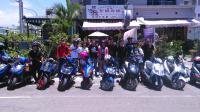 a group of people standing next to their motorcycles at Garden Rose Homestay in Taitung City