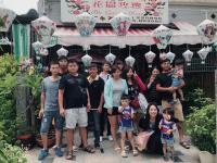 a group of people standing in front of a store at Garden Rose Homestay in Taitung City