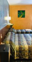 A bed or beds in a room at Hotel Parco Fiera