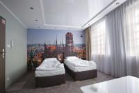 Posteľ alebo postele v izbe v ubytovaní Apartamenty Żuraw