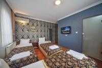 A bed or beds in a room at Hotel Akcinar