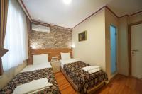 A bed or beds in a room at Hotel Akcinar
