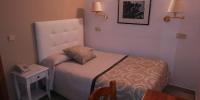 Postel nebo postele na pokoji v ubytování Hostal Centro