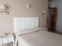 Postel nebo postele na pokoji v ubytování Hostal Centro