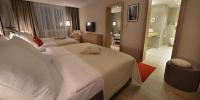 Postel nebo postele na pokoji v ubytování Apollo Hotel Bratislava