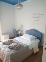 A bed or beds in a room at La Dimora del Conte