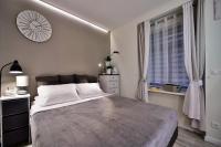 Posteľ alebo postele v izbe v ubytovaní Apartamenty Sjesta Centrum