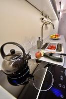 Kuchyňa alebo kuchynka v ubytovaní Apartamenty Sjesta Centrum
