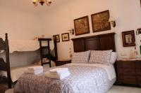 Postel nebo postele na pokoji v ubytování Boutique house LujoPobre