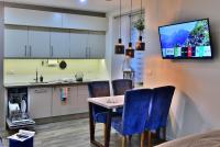 Kuchyňa alebo kuchynka v ubytovaní Apartamenty Sjesta Centrum
