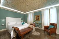 Posteľ alebo postele v izbe v ubytovaní La Ribezza Boutique Hotel