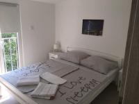 Postel nebo postele na pokoji v ubytování Apartman Bunarić