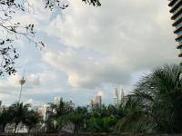 Blick auf eine Stadt mit Gebäuden und Palmen in der Unterkunft KL Service Suites at Times Square KL in Kuala Lumpur