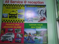 a poster on a wall with different types of cars at Samui Green Hotel in Chaweng