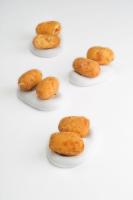 a group of donuts on plates on a white background at Hotel Echaurren Relais & Châteaux in Ezcaray
