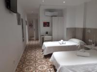 Postel nebo postele na pokoji v ubytování Hostal Nova Barcelona