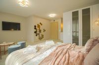 Postel nebo postele na pokoji v ubytování Boutique Apartments Blagoevgrad