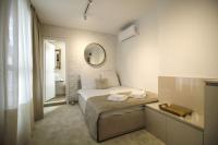Postel nebo postele na pokoji v ubytování Boutique Apartments Blagoevgrad