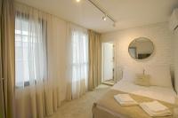 Postel nebo postele na pokoji v ubytování Boutique Apartments Blagoevgrad