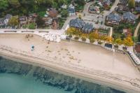 an aerial view of a beach with a resort at StrandHotel Seeblick, Ostseebad Heikendorf in Heikendorf