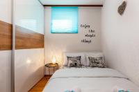 Postel nebo postele na pokoji v ubytování Apartments Lulic
