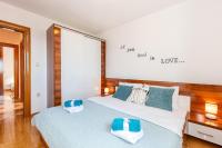 Postel nebo postele na pokoji v ubytování Apartments Lulic