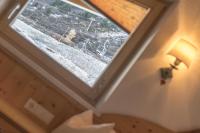 A bed or beds in a room at Das Hochegg - Apartments