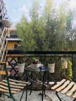 A balcony or terrace at Stefanias sunny Acropolis Studio on Drakou pedestrian