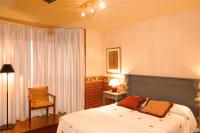 Postel nebo postele na pokoji v ubytování Hotel Avenida Real