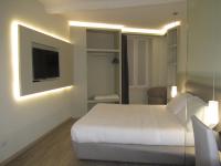 Televízia a/alebo spoločenská miestnosť v ubytovaní Hotel Borgovico