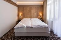 Posteľ alebo postele v izbe v ubytovaní Urpí­n City Residence