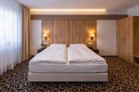 Posteľ alebo postele v izbe v ubytovaní Urpí­n City Residence