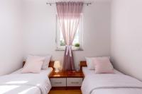 Postel nebo postele na pokoji v ubytování Apartments Lulic