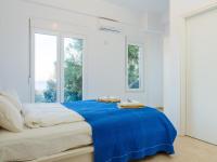 A bed or beds in a room at Villa Mariou