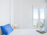 A bed or beds in a room at Villa Mariou