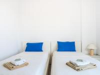 A bed or beds in a room at Villa Mariou