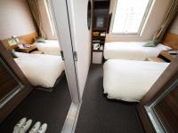 Natural Hot Spring SUPER HOTEL Kumamoto Chamber of Commerceにあるベッド