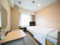 Natural Hot Spring SUPER HOTEL Kumamoto Chamber of Commerceにあるテレビまたはエンターテインメントセンター