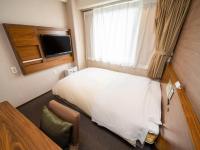 Natural Hot Spring SUPER HOTEL Kumamoto Chamber of Commerceにあるテレビまたはエンターテインメントセンター