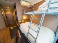 Natural Hot Spring SUPER HOTEL Kumamoto Chamber of Commerceにあるベッド