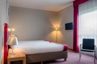 Televízia a/alebo spoločenská miestnosť v ubytovaní Focus Hotel Katowice Chorzów