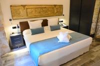 Posteľ alebo postele v izbe v ubytovaní Hotel Molí de l'Escala